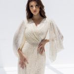 Celia evening gown featuring a surplice neck cut, mermaid silhouette, adorned with sequins and crystals.”